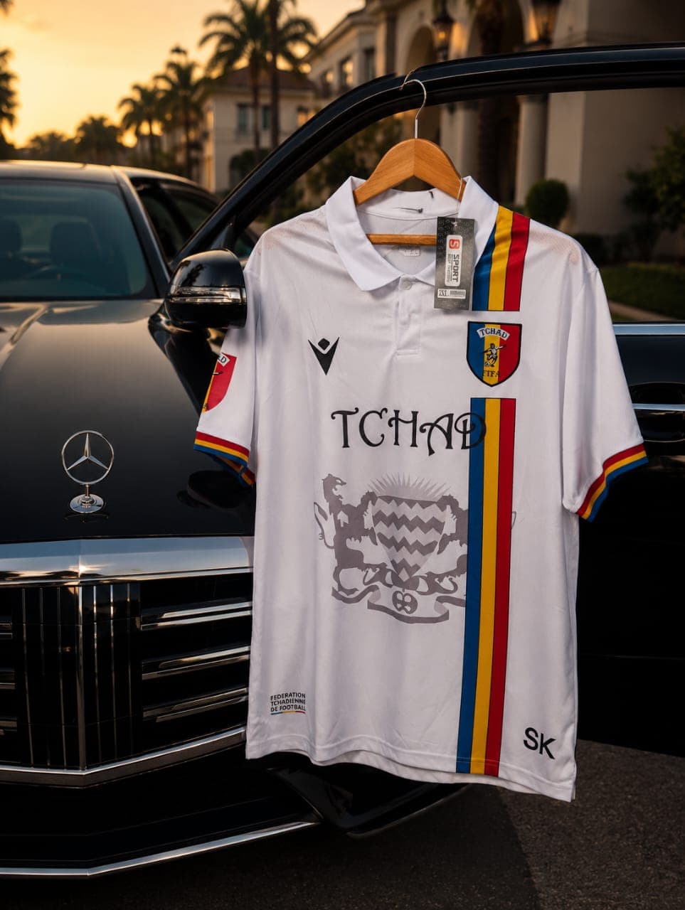White Chad national football team polo jersey with crest and stripes.