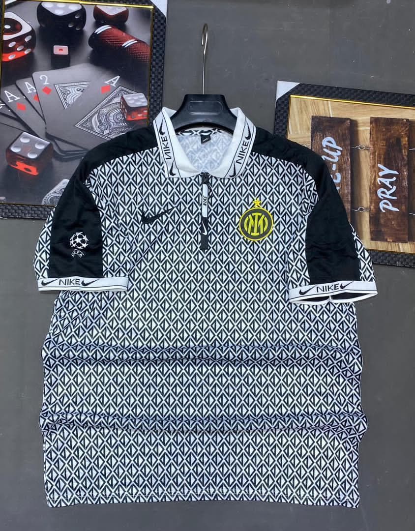 Patterned black and white Nike Inter Milan retro jersey with zip collar.