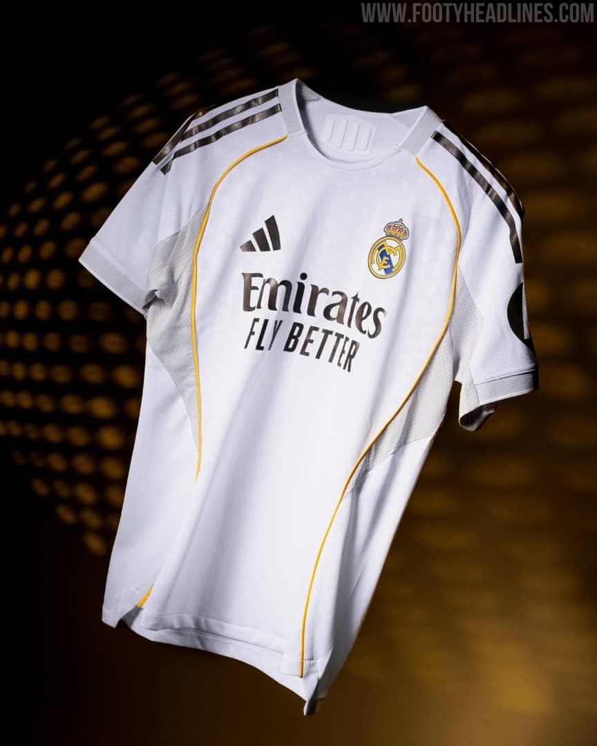White Real Madrid Adidas home jersey floating against dark background.