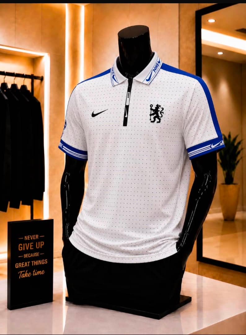 White dotted Chelsea Nike polo jersey displayed on mannequin.