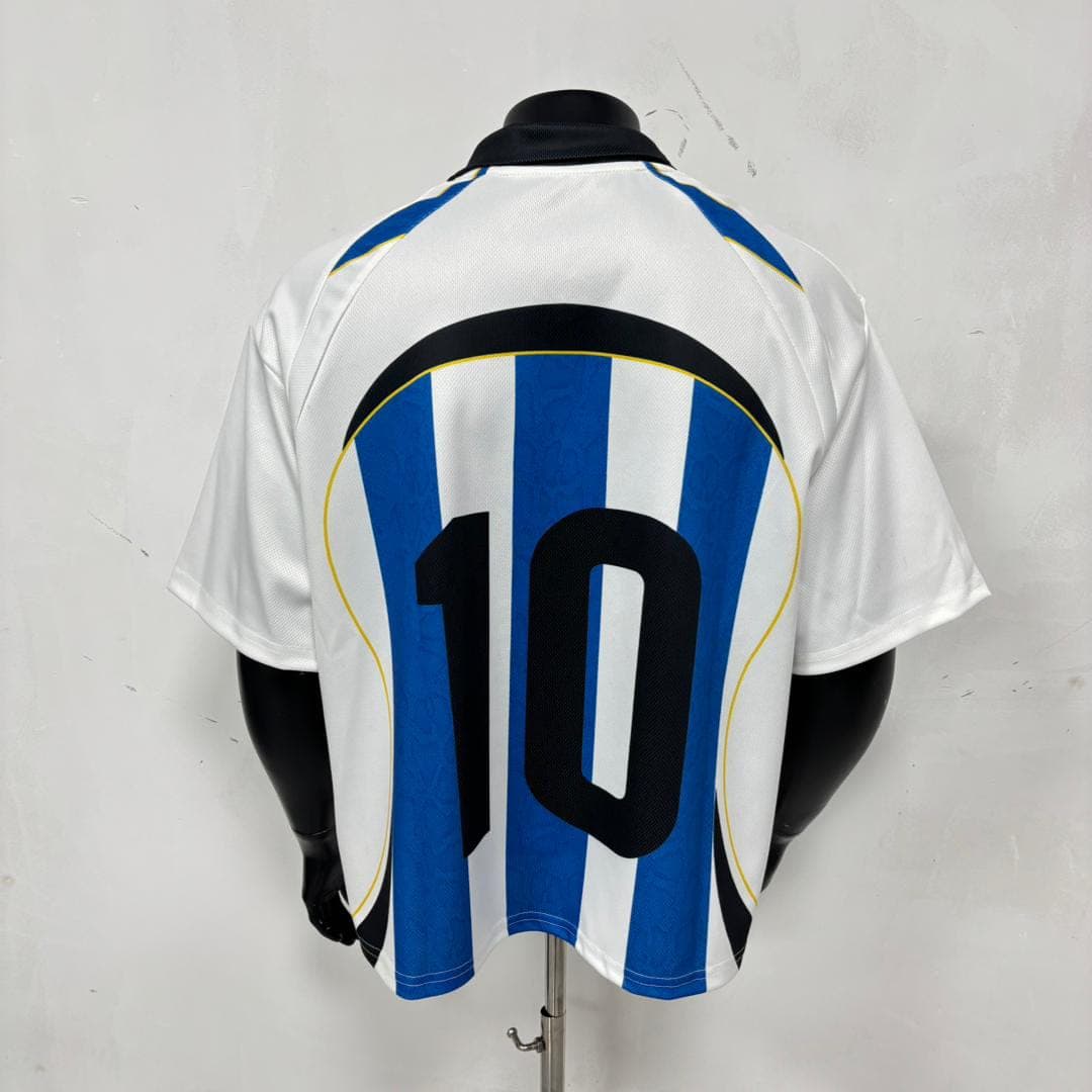 Back view of Argentina football jersey on mannequin displaying large black number 10.