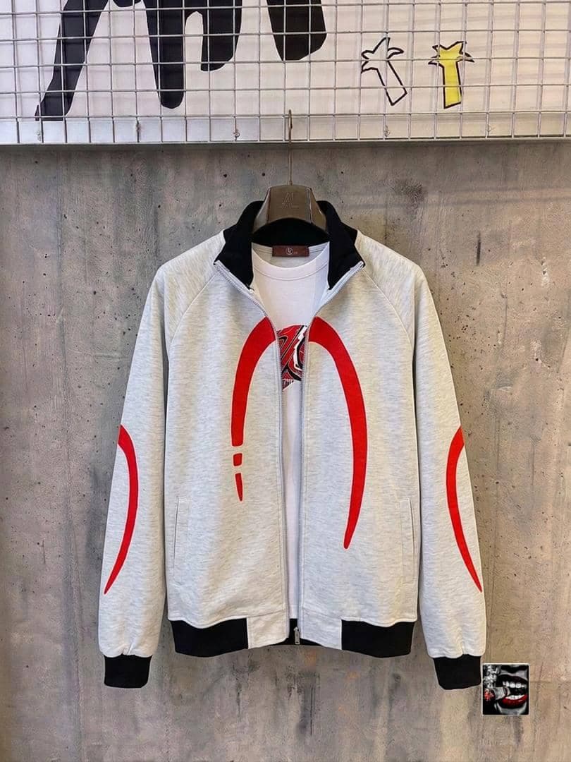 Light grey zip jacket with red curved graphics and white t-shirt underneath.
