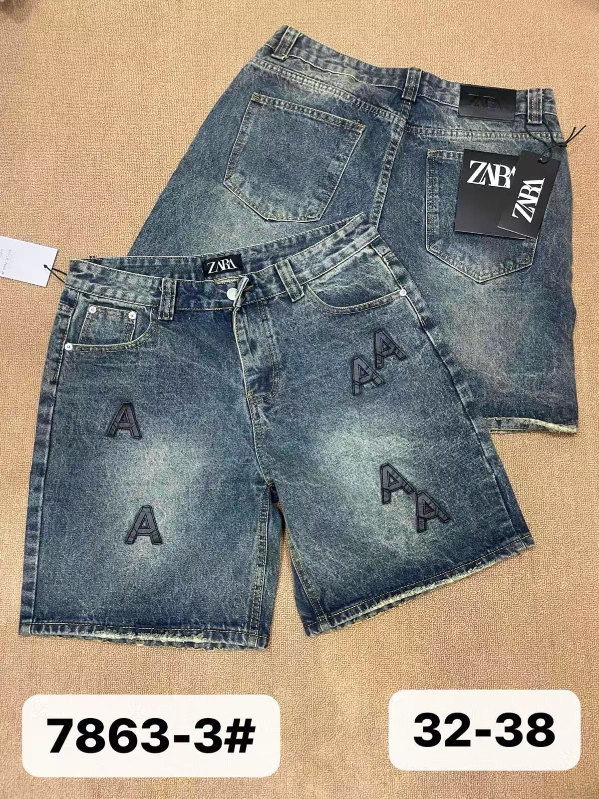 Light blue denim shorts with A patches on front and back, shown with branding tags.