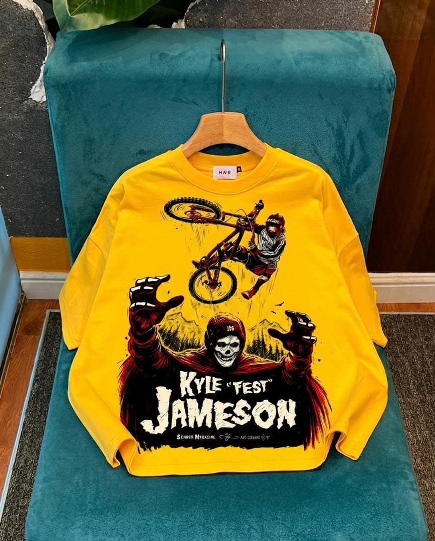 Yellow long sleeve tee with BMX rider and skeleton graphic.