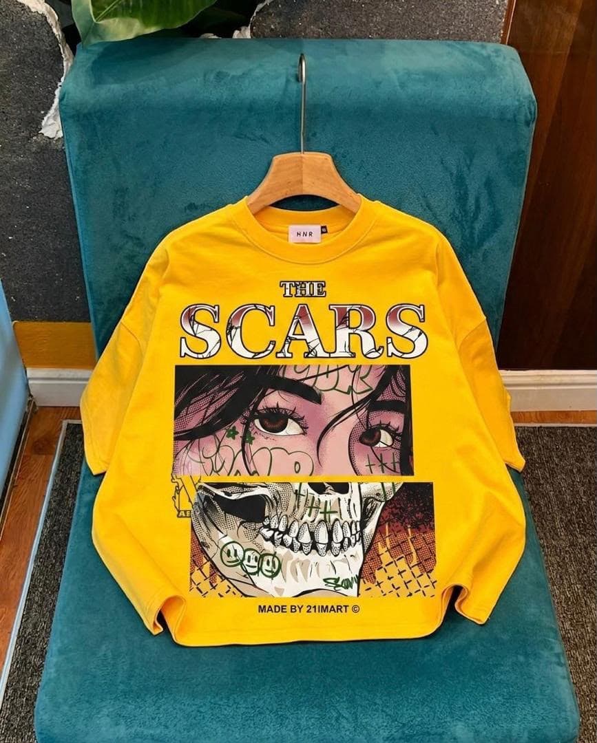 Yellow long sleeve tee with The Scars comic face and skull graphic.