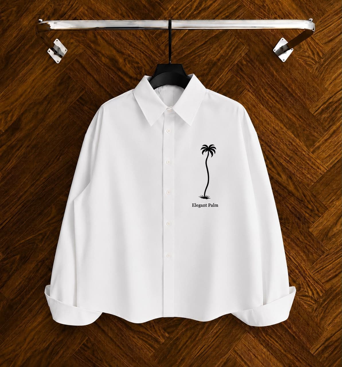 White long sleeve Elegant Palm shirt flat on hanger showing chest graphic.