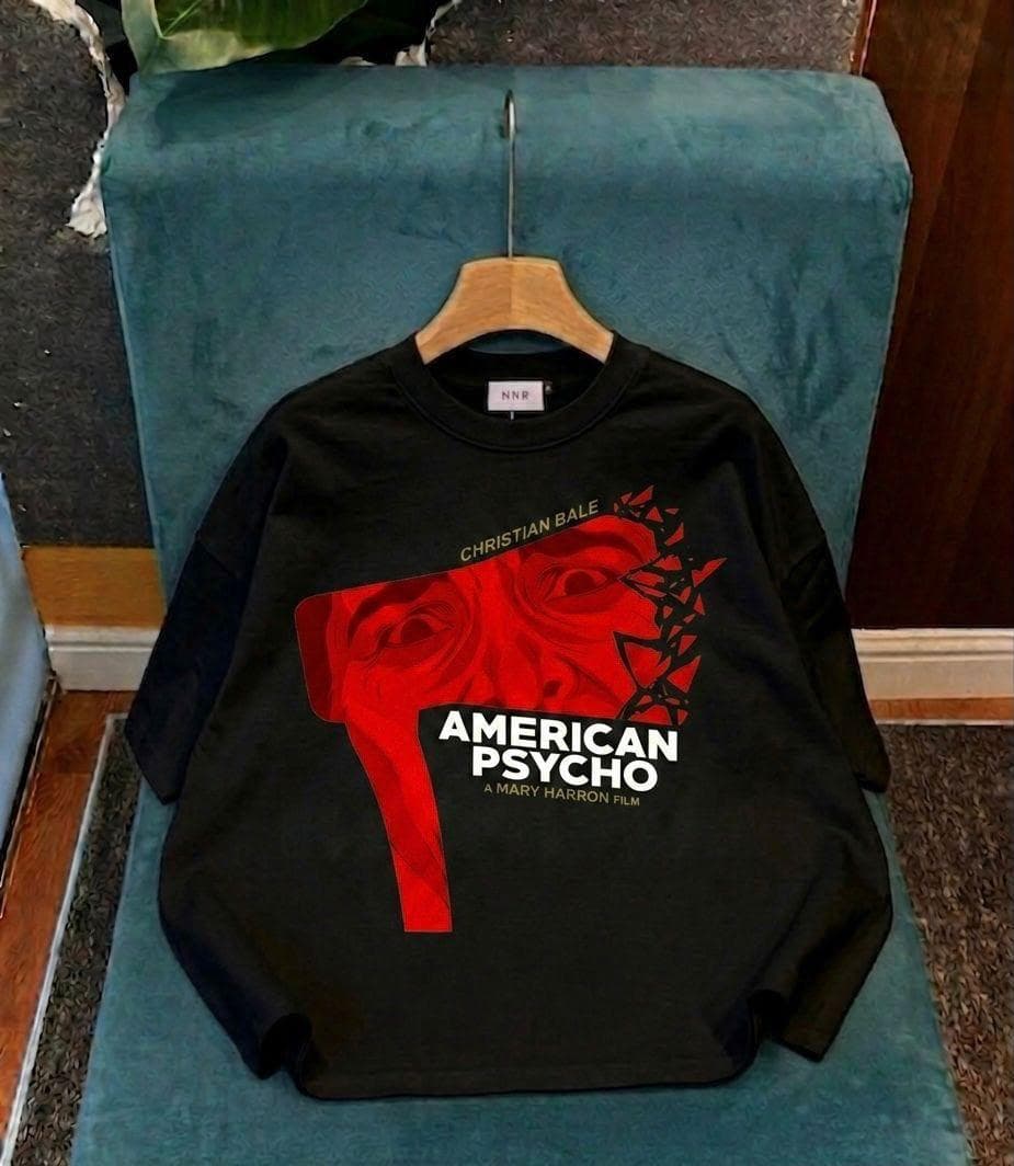 Black crop tee with red American Psycho face graphic and movie text.