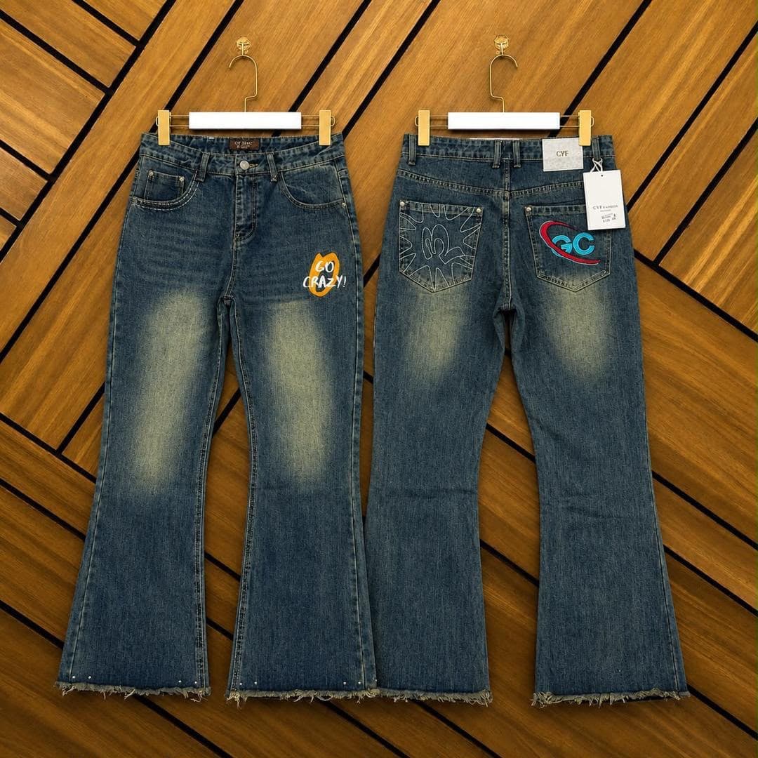 Two pairs of blue flared jeans on wooden hangers showing Go Crazy patch and GC back pocket design.