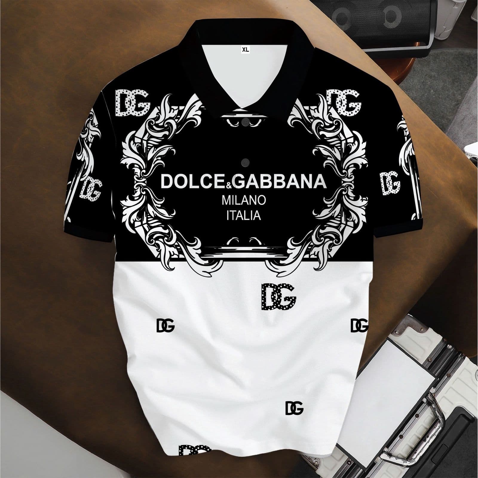 Black and white Dolce & Gabbana polo with ornate patterns and large logos.