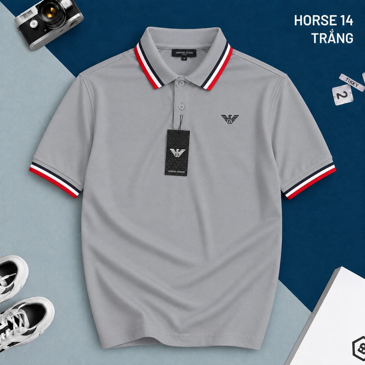 Gray Armani polo shirt with red white blue trim and eagle logo on chest.