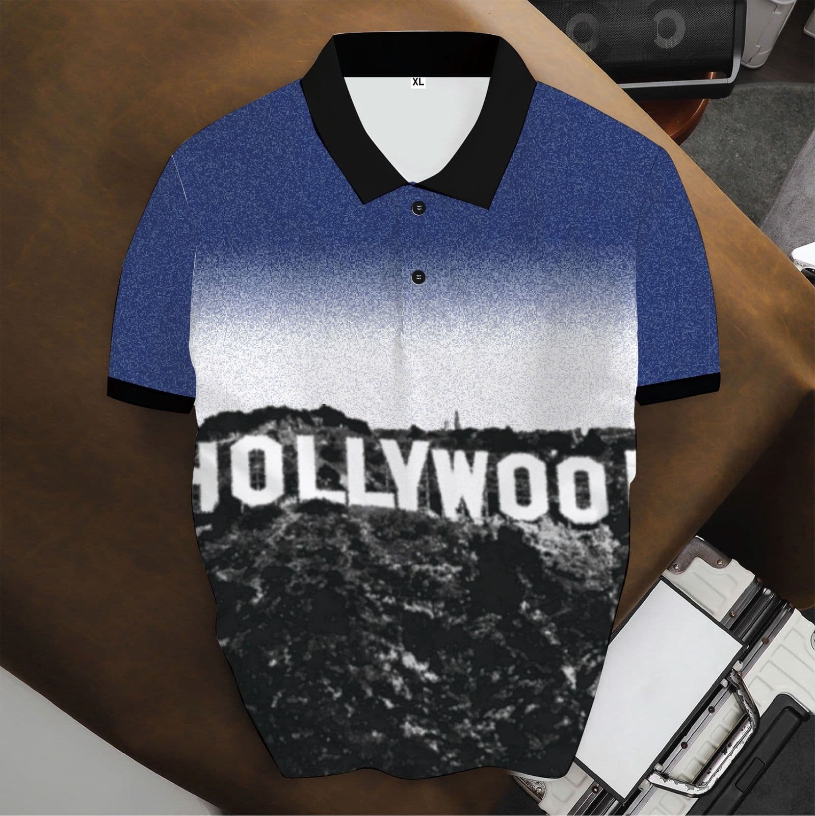 Blue and white gradient polo shirt with HOLLYWOOD text and landscape print.