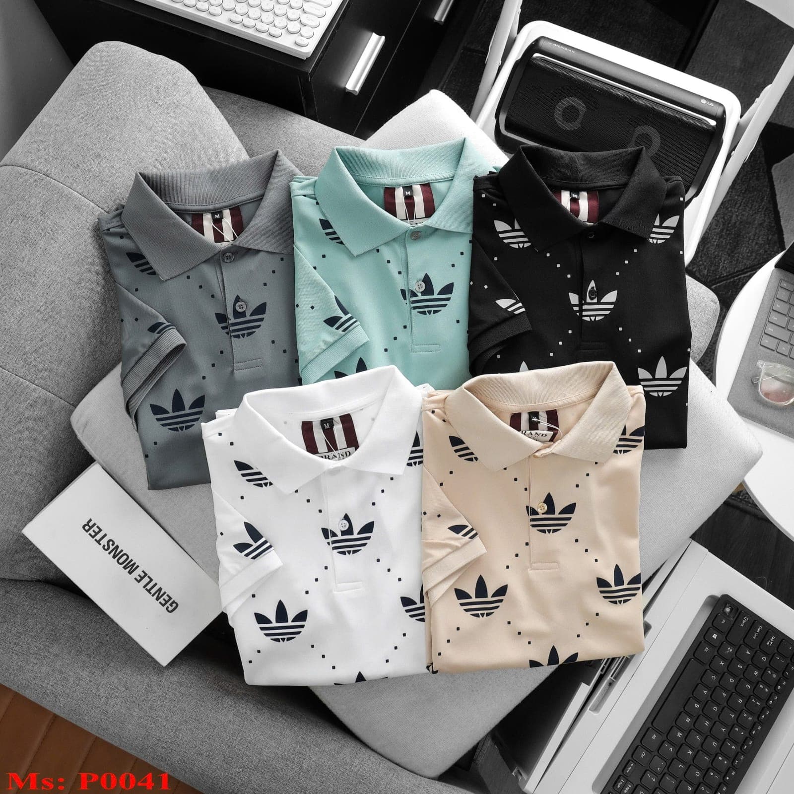 Five Adidas-style polos in gray, mint, black, white and beige with dotted pattern and trefoil logos.