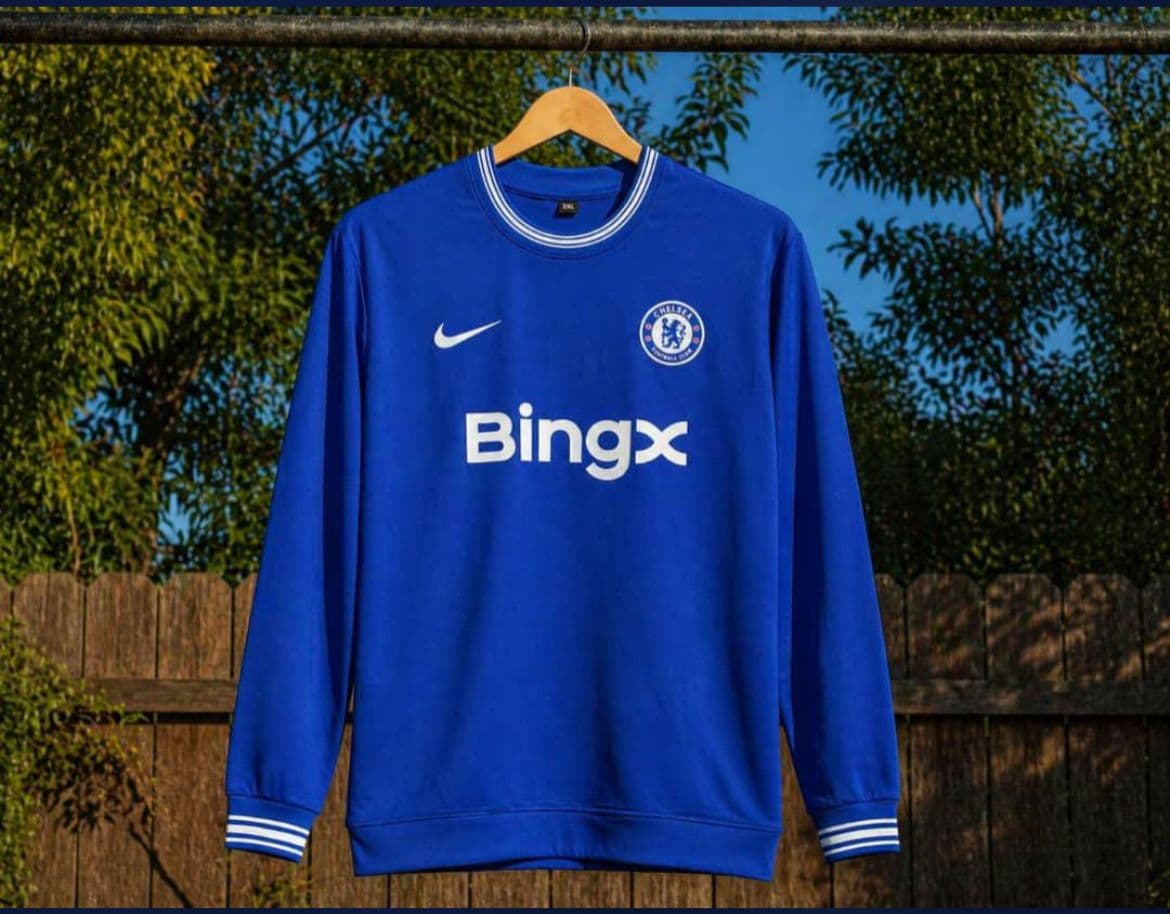 Blue Chelsea long sleeve jersey with BingX sponsor and white striped trim.