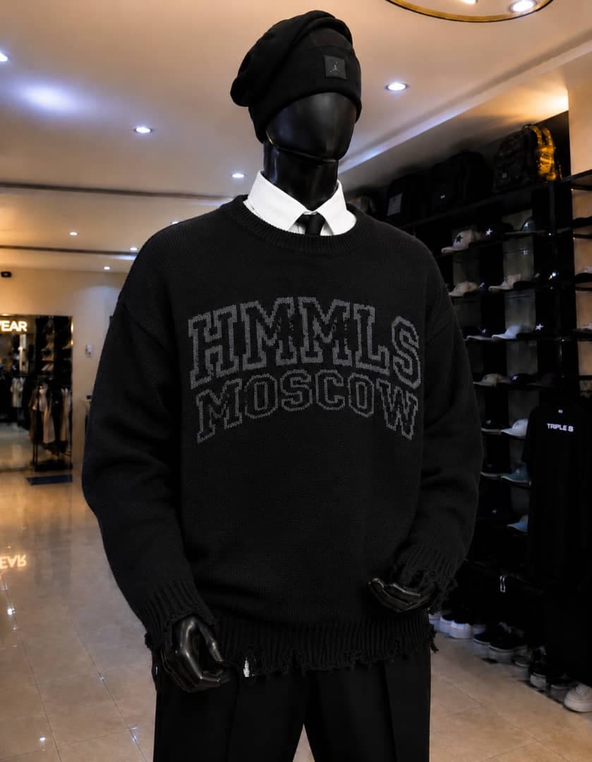 Mannequin wearing black HMMLS MOSCOW graphic sweatshirt with distressed hem.