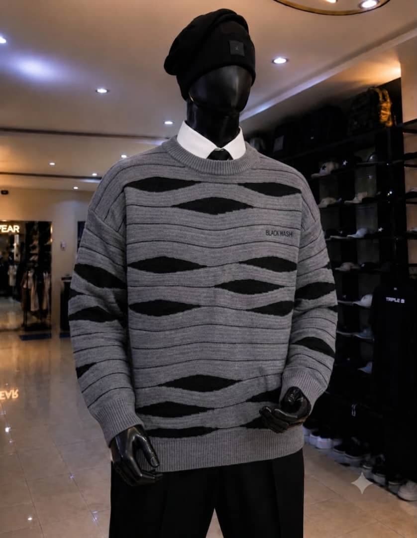 Mannequin wearing gray and black wave pattern sweatshirt with BLACKWASH text.