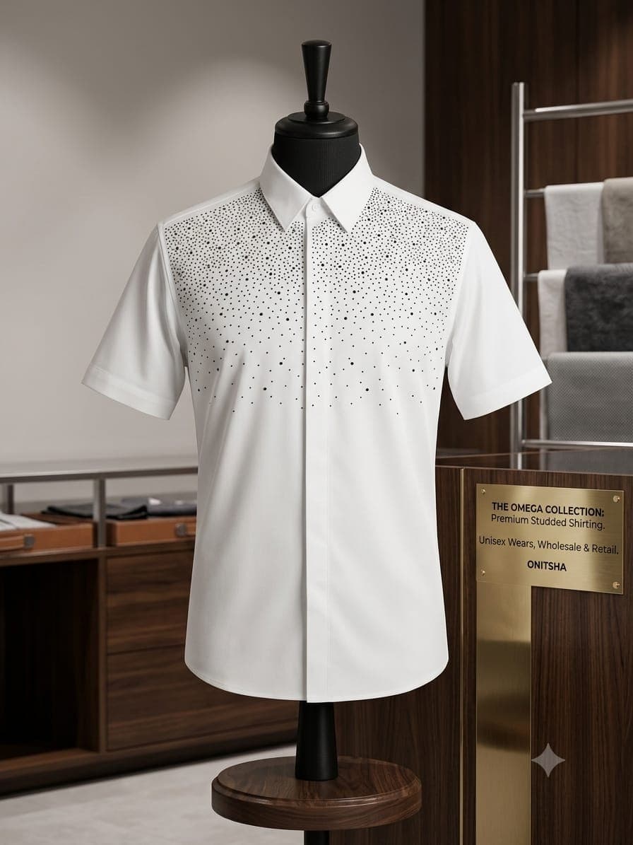White short sleeve studded shirt on mannequin with black dot embellishments on chest.