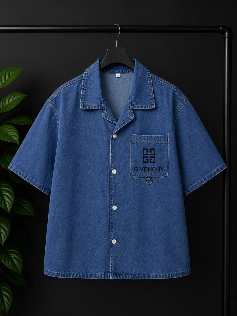 Blue denim short-sleeve button-up shirt with Givenchy logo on pocket and metal ring.