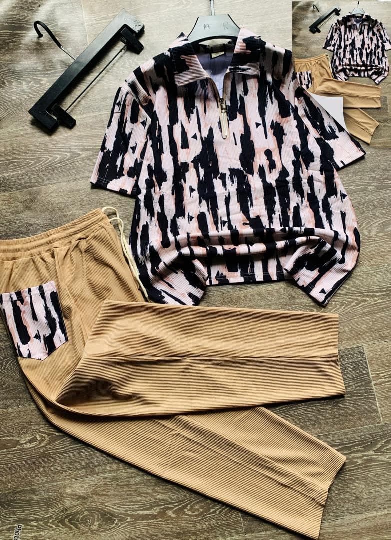 Pink abstract print ribbed quarter-zip polo two-piece set.
