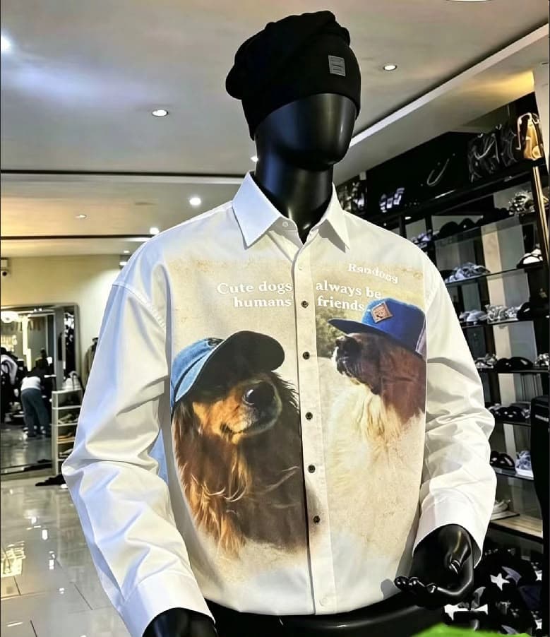 White long sleeve shirt with cute dogs graphic on mannequin.