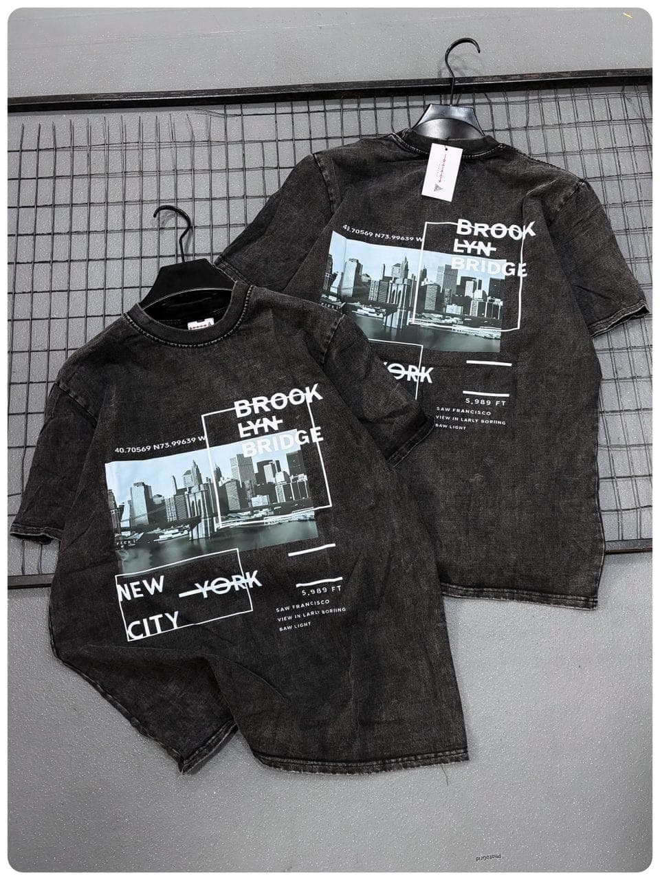 Front and back views of black stonewashed t-shirt with Brooklyn Bridge and New York graphics.