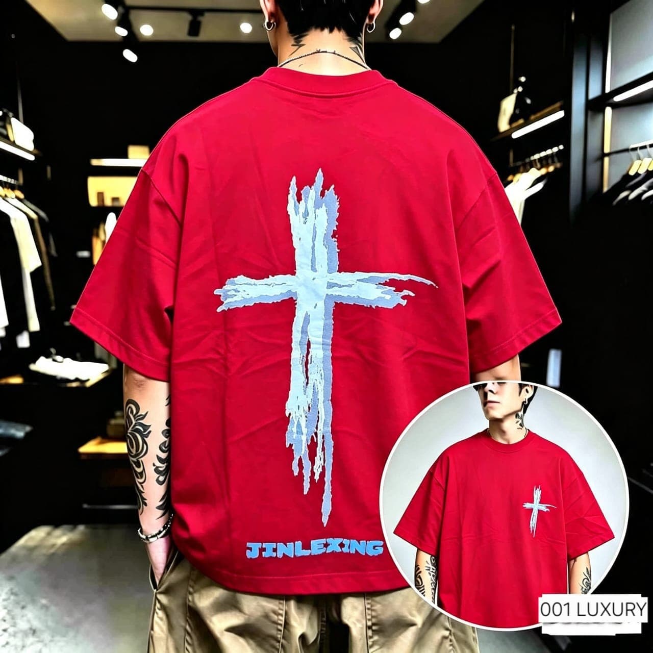 Man wearing red cross graphic oversized t-shirt showing back print.