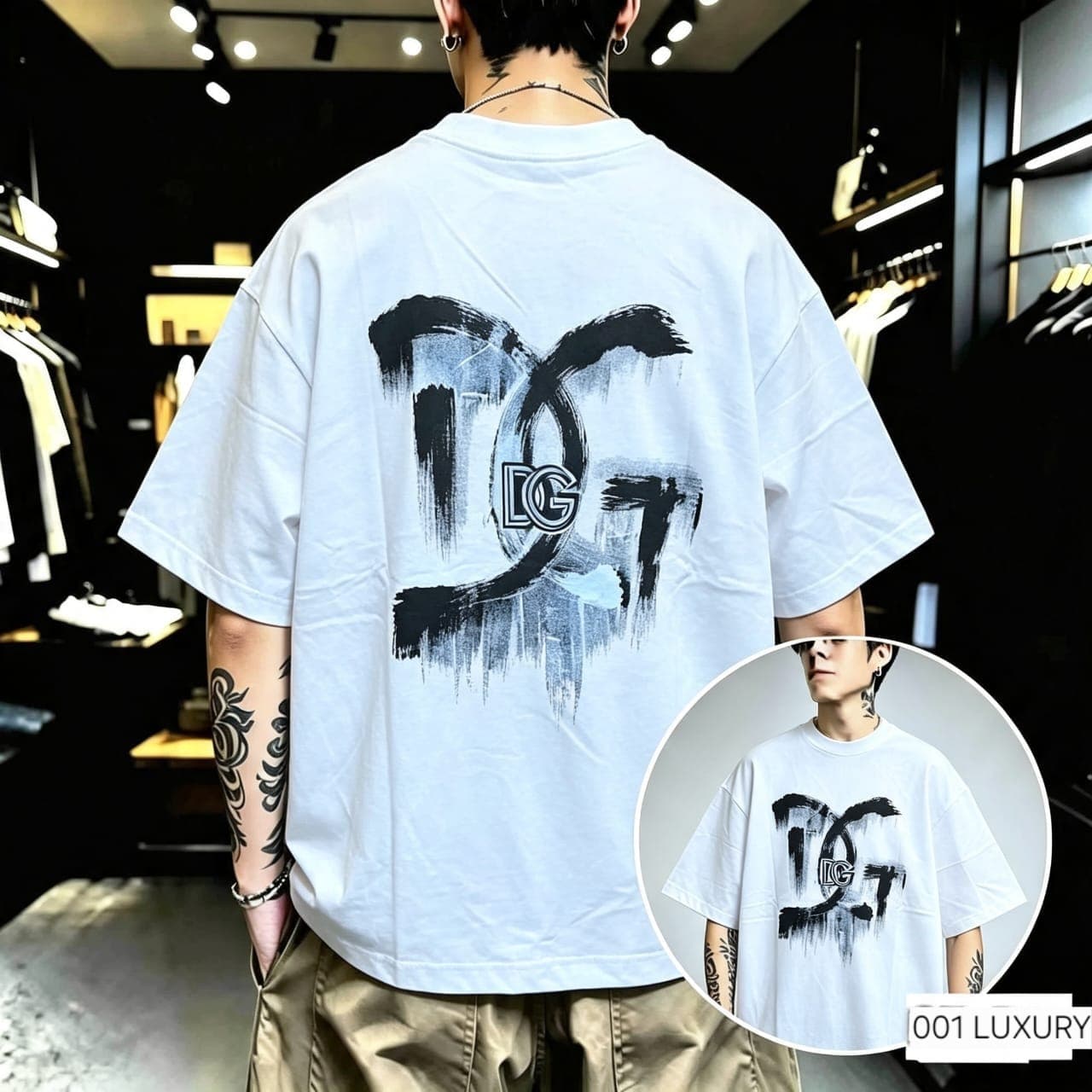 Back view of model in white oversized t-shirt with black brush stroke logo.