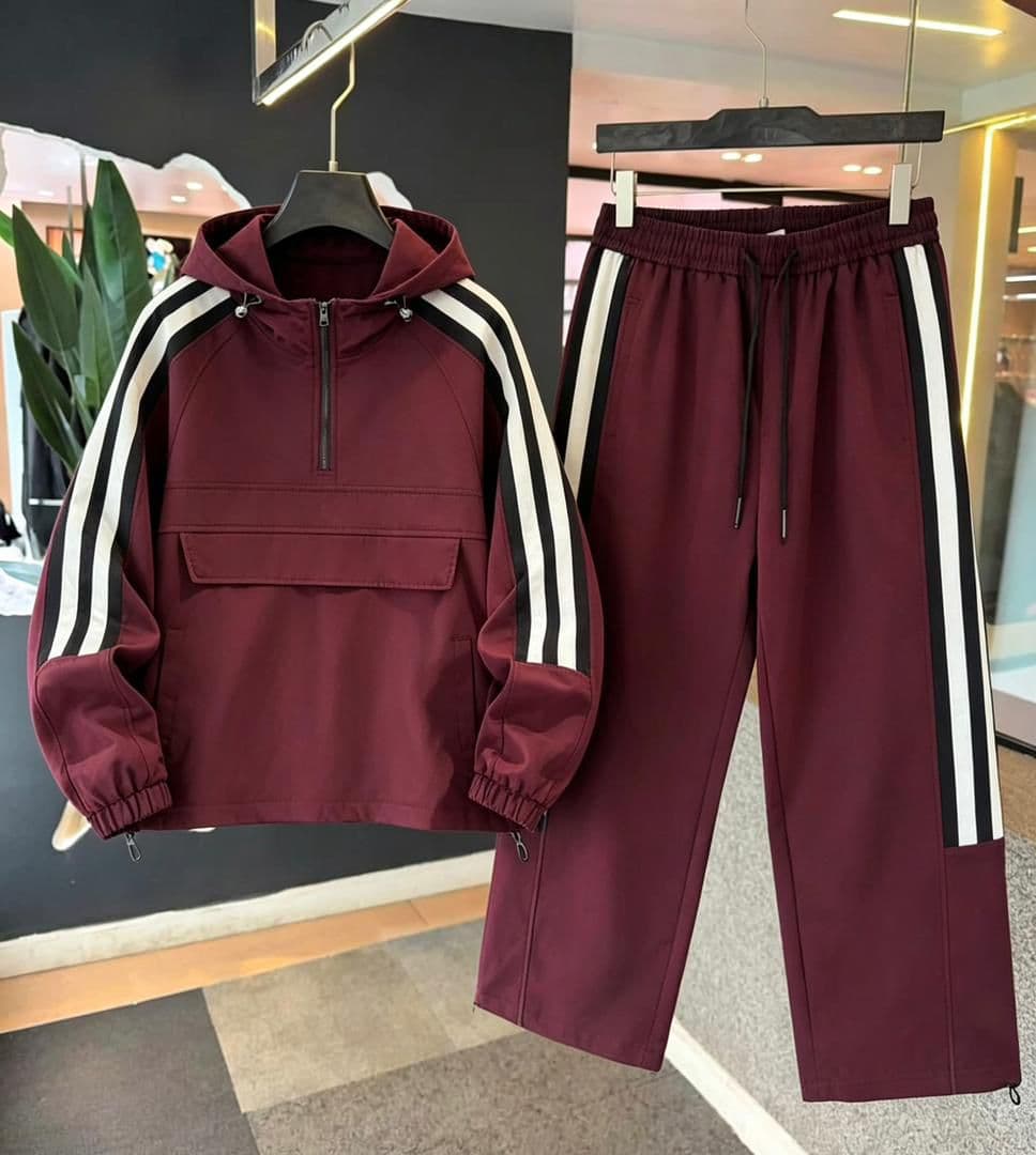 Burgundy striped hooded cargo tracksuit set with black and white accents on jacket sleeves and pants.