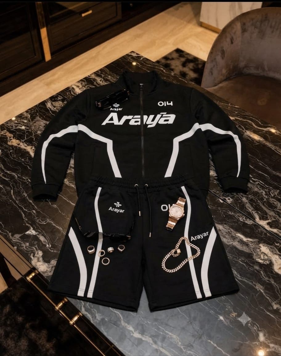 Black Araya two-piece set with white stripes, branding, and multiple accessories including watch and chain.