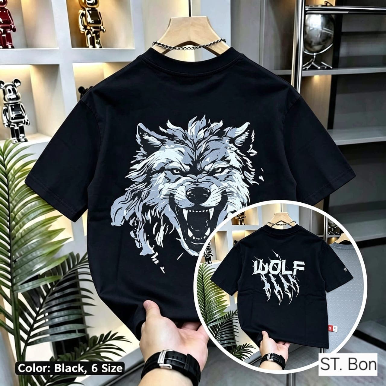 Black t-shirt with wolf head back graphic and front WOLF claw print inset.