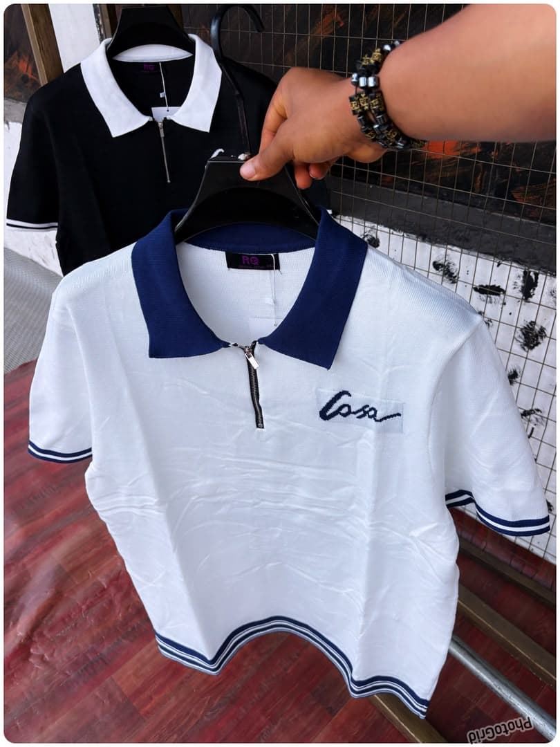 White contrast collar quarter-zip polo shirt with Casa embroidery.