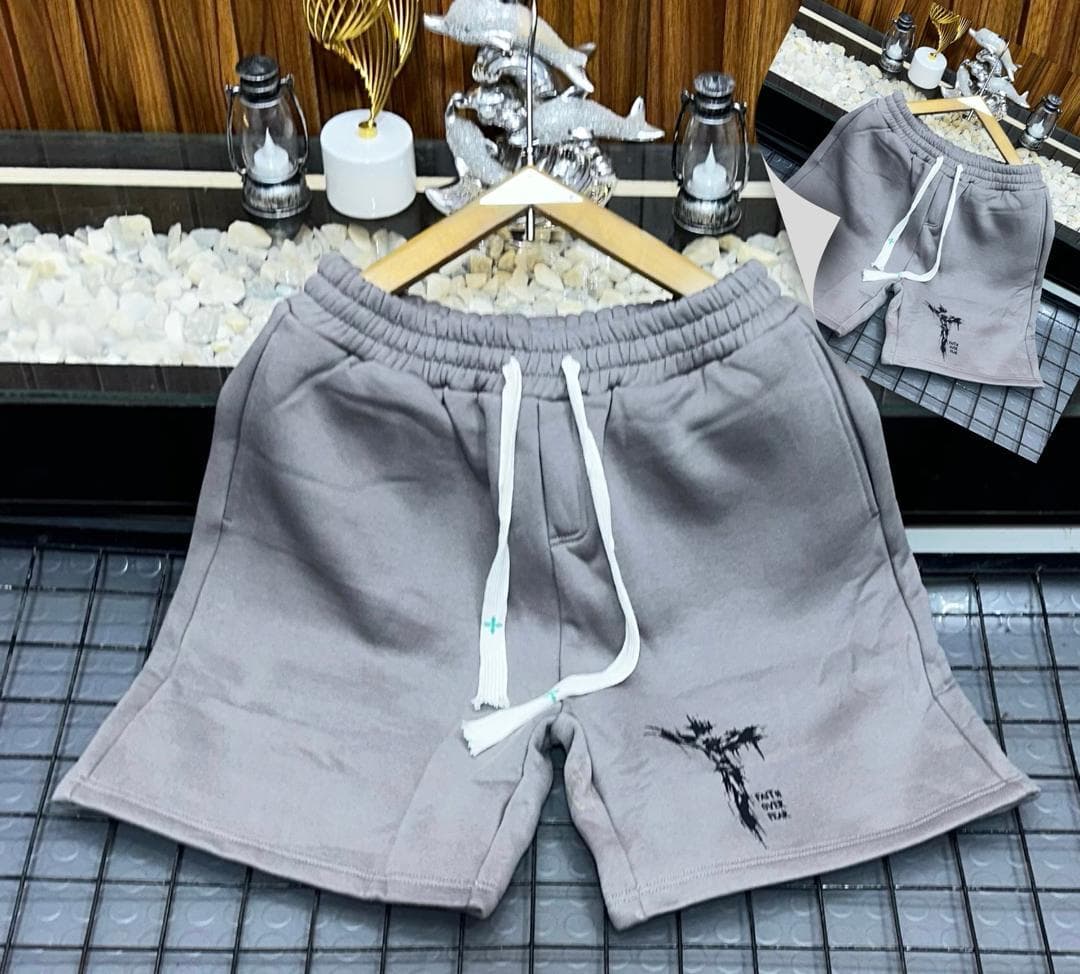 Gray fleece shorts with black splatter design and FAITH OVER FEAR text.