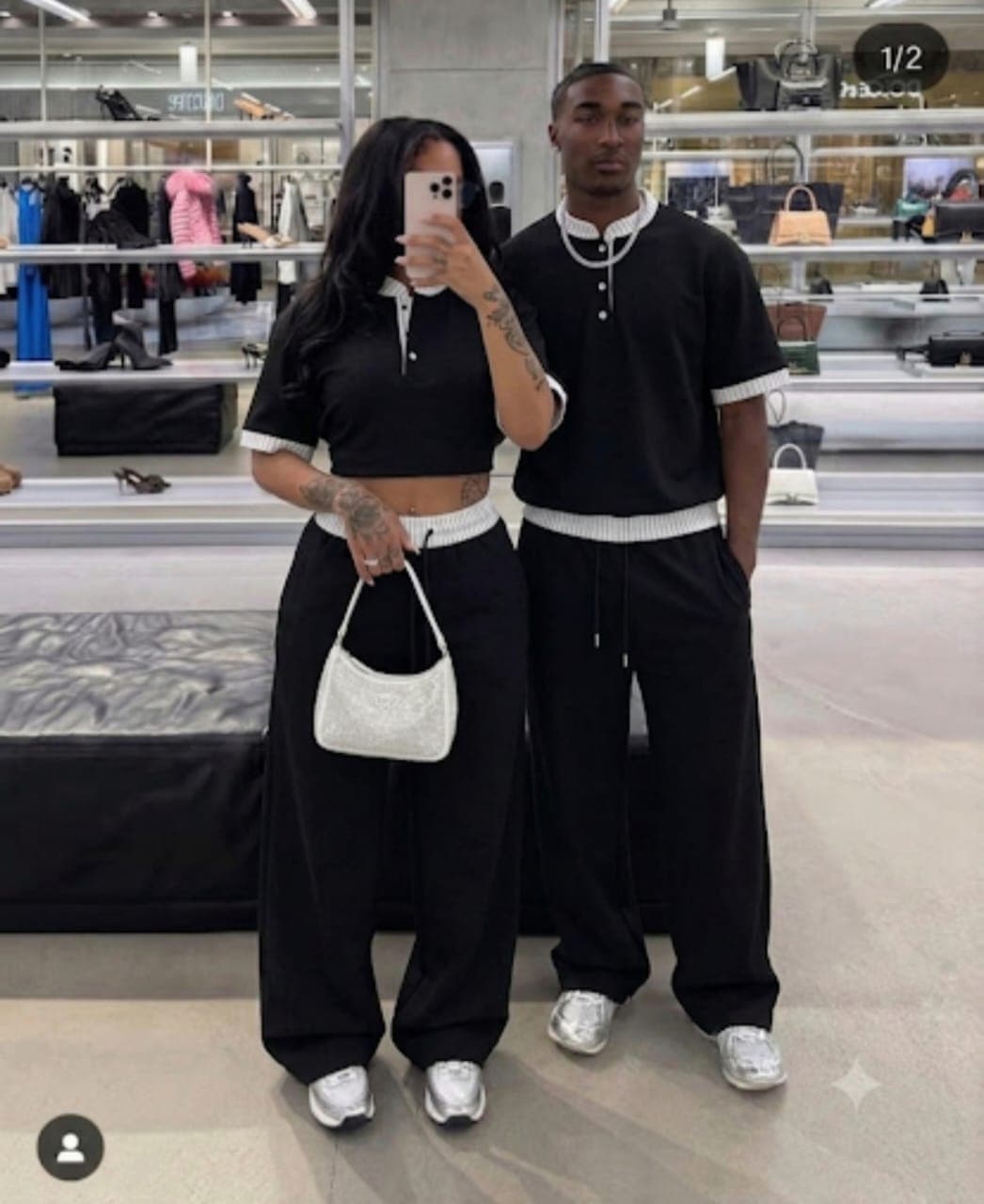 Couple modeling matching black cropped polo top and wide-leg pants two-piece set.