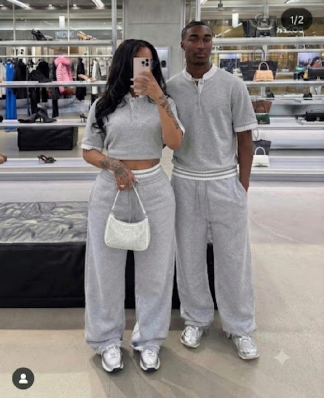 Couple modeling matching gray cropped polo top and wide-leg pants two-piece set.