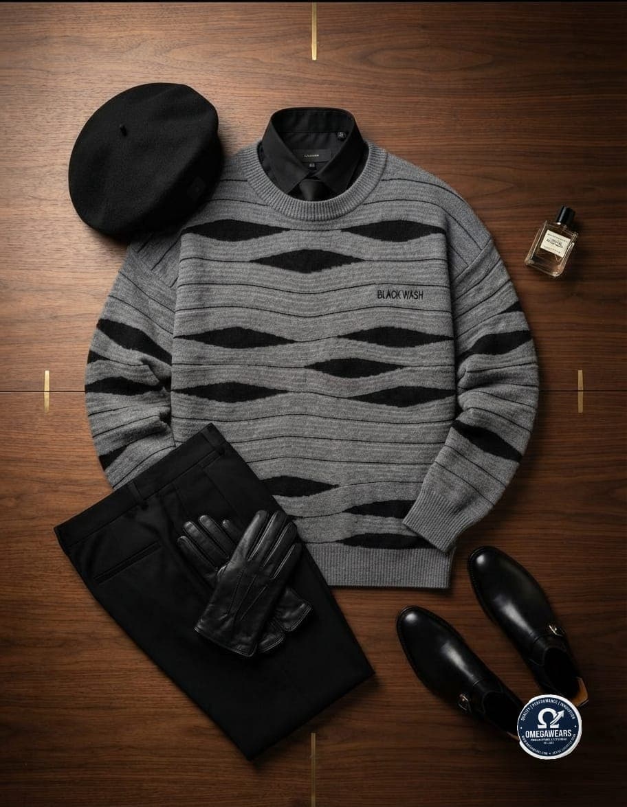 Flat lay of gray and black wave patterned knit sweater with black corporate trousers, shirt, tie, beret, gloves and shoes on wooden surface.