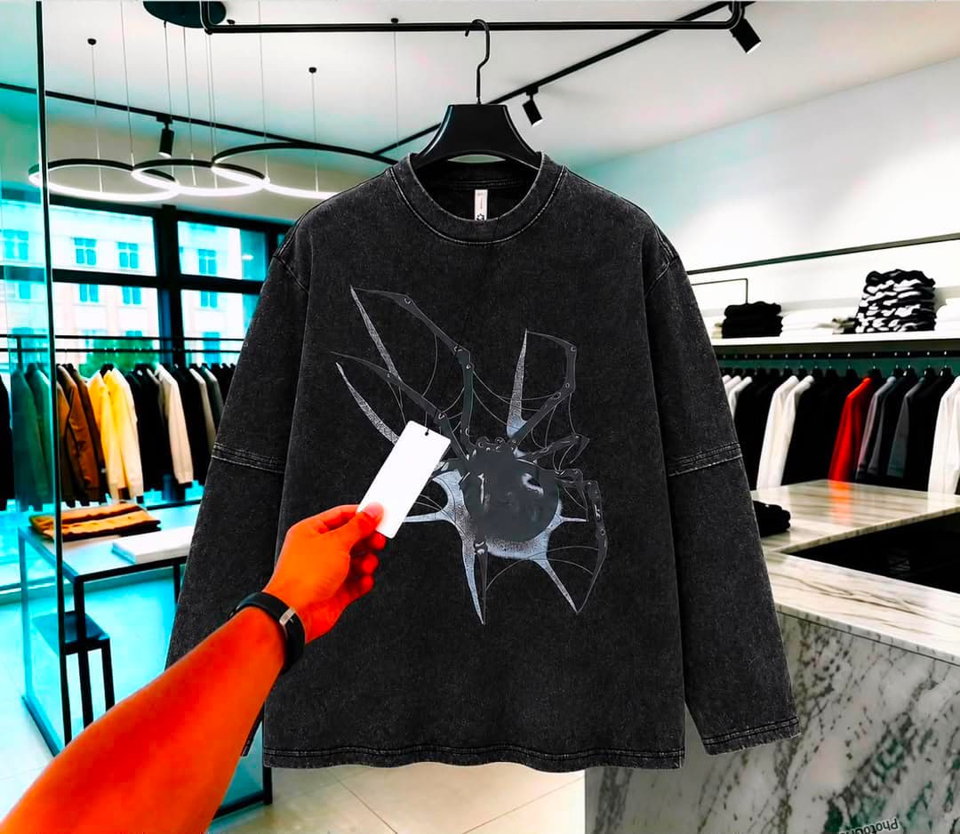 Stonewashed black long sleeve t-shirt with spider and web breaking through graphic.