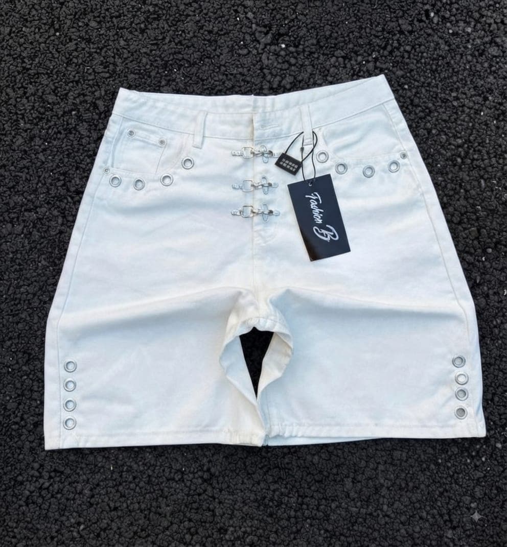 Light blue denim shorts with silver grommets and buckle details on front.