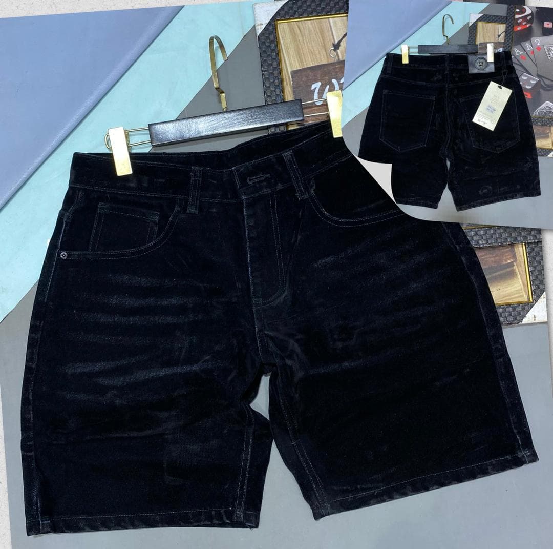 Black velvet shorts shown in front and back views with tags.