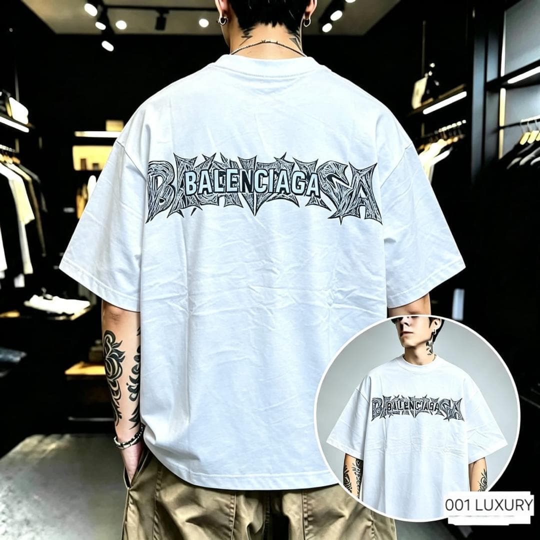 Man in white Balenciaga graphic oversized t-shirt, back view with black stylized logo.