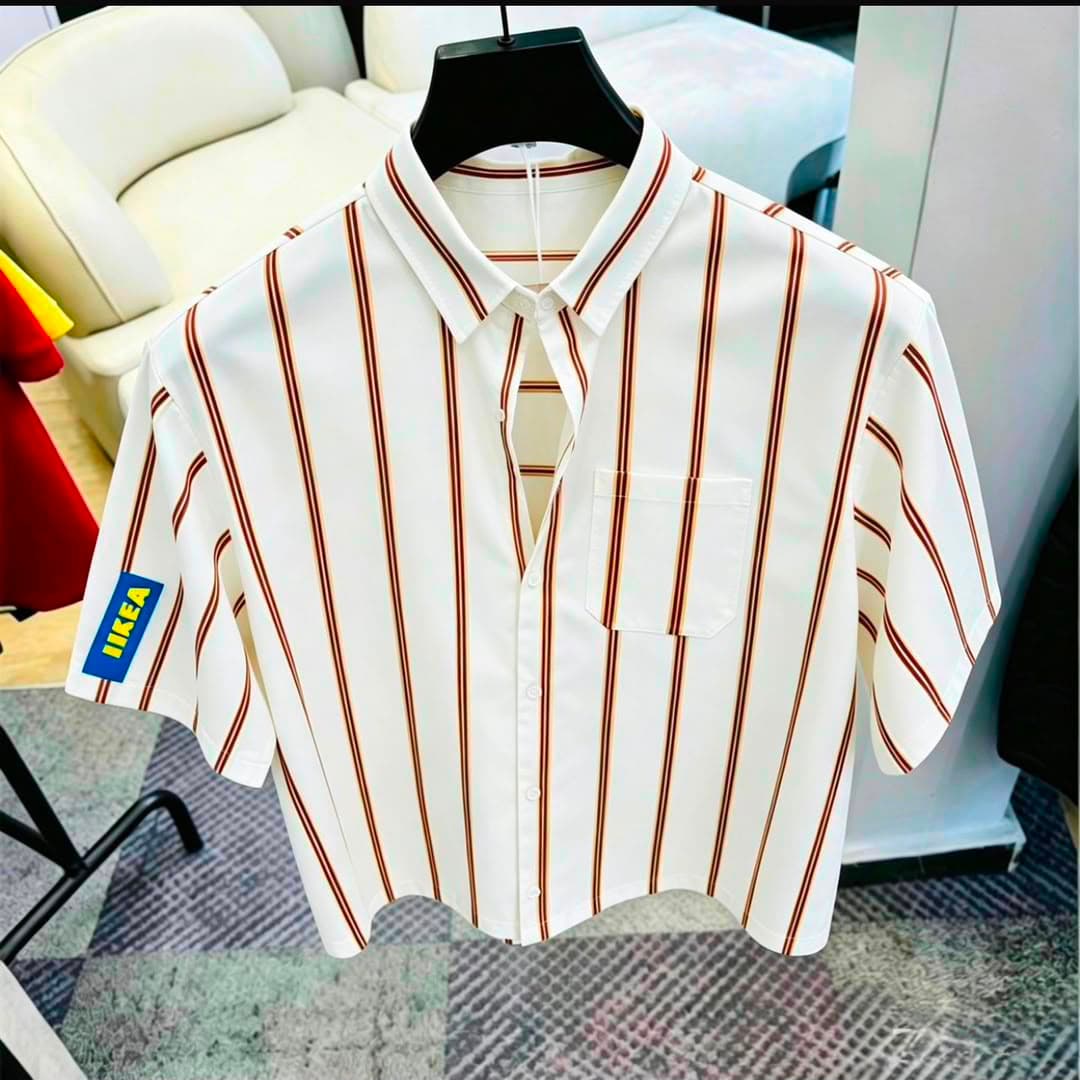 White striped short sleeve button-down shirt with chest pocket on black hanger.