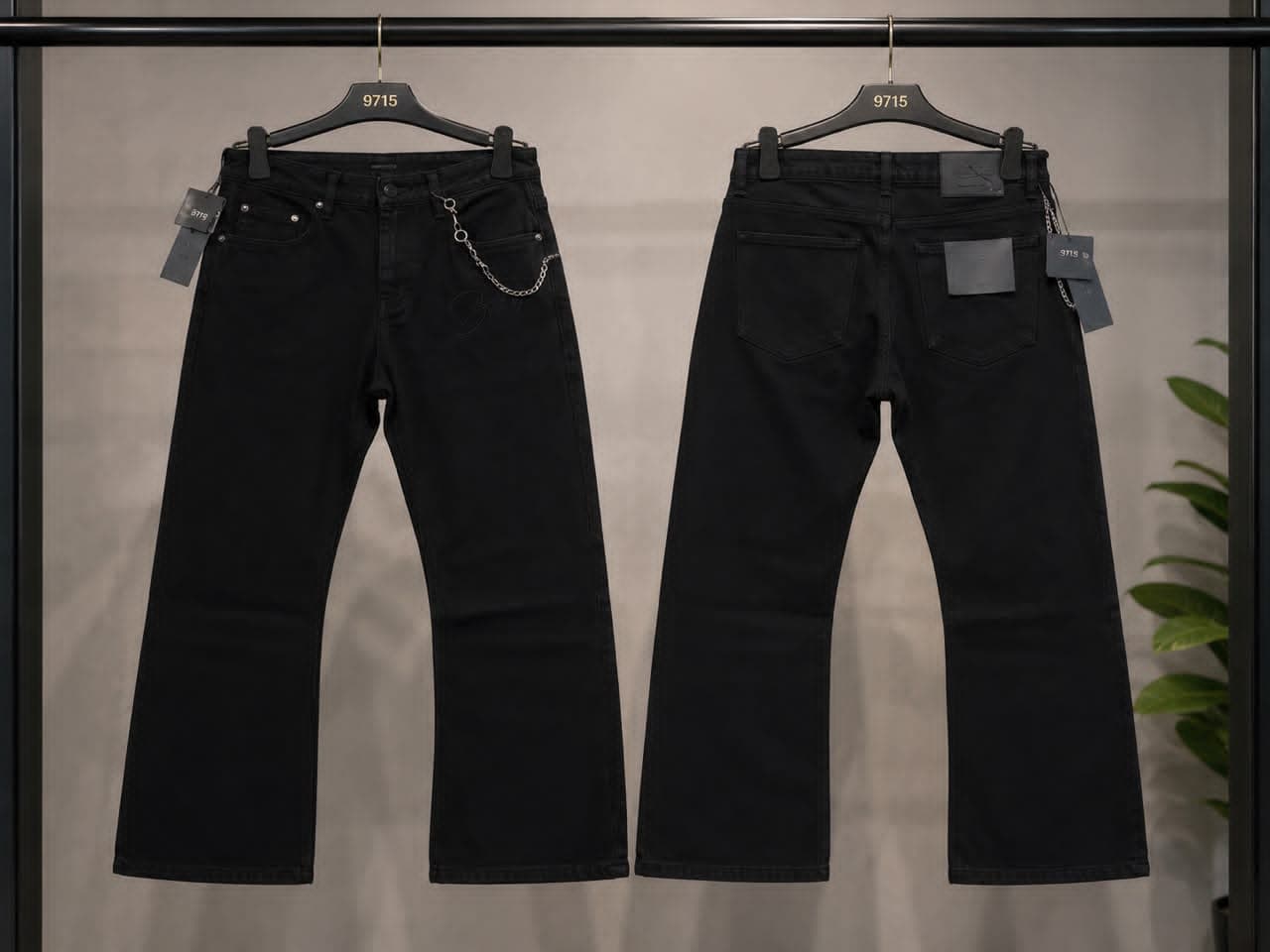 Black baggy jeans with chain detail on front pocket and heart embroidery, front and back views.