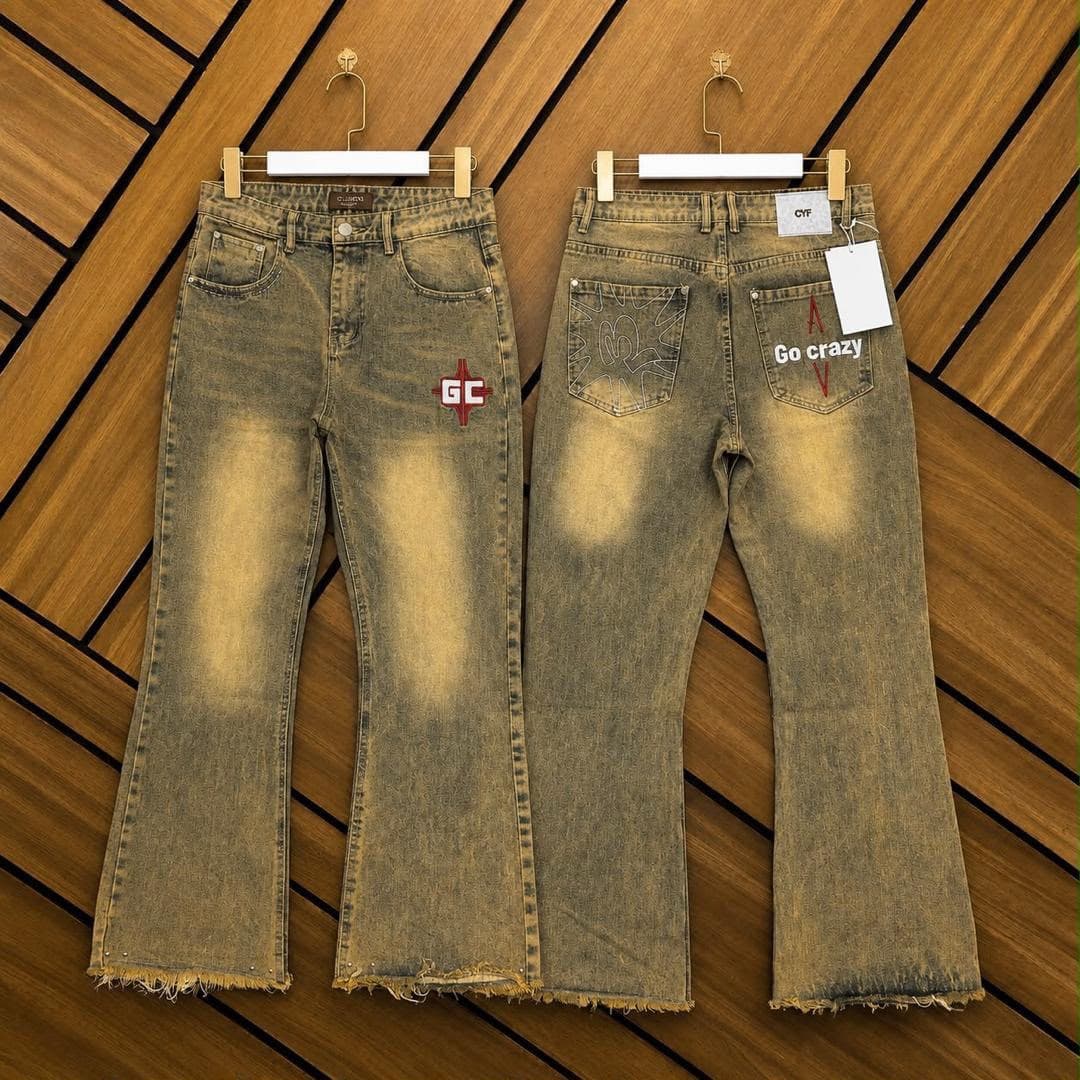 Two pairs of faded baggy flare jeans: one with GC logo on front, one with Go crazy text on back pocket.