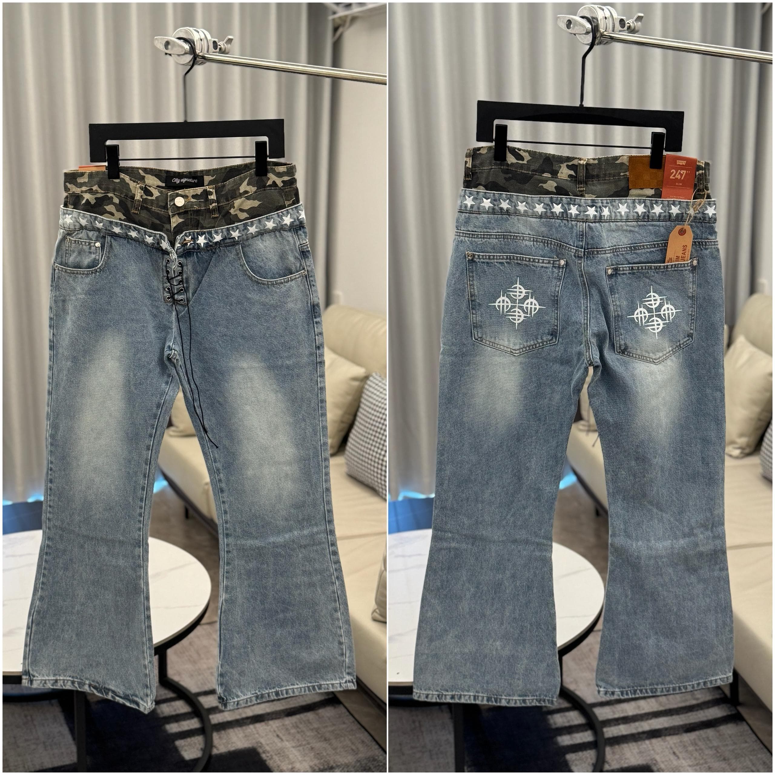 Light blue flared jeans with camo waistband, star trim and cross embroidery on back.