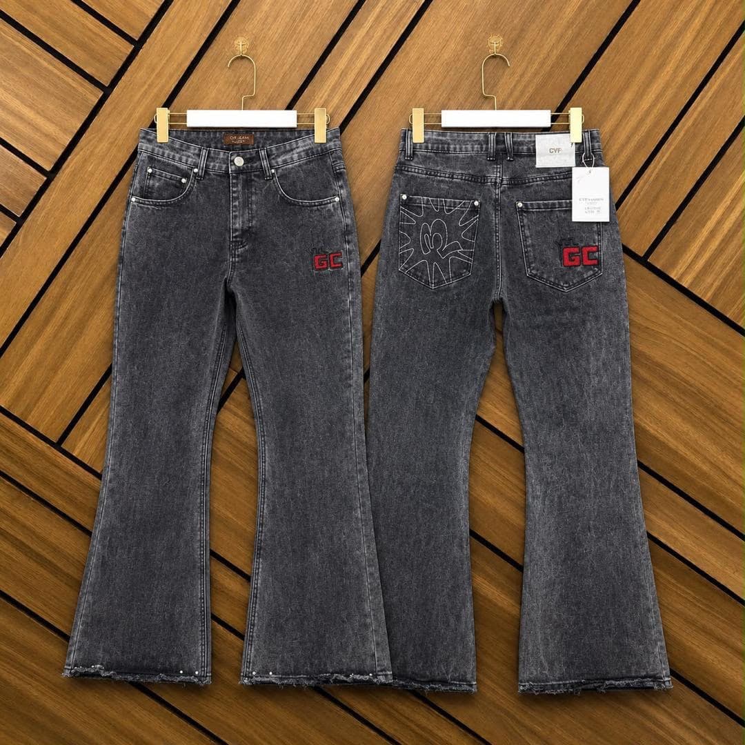 Front and back views of gray flared jeans with red GC logo and white pocket graphic.