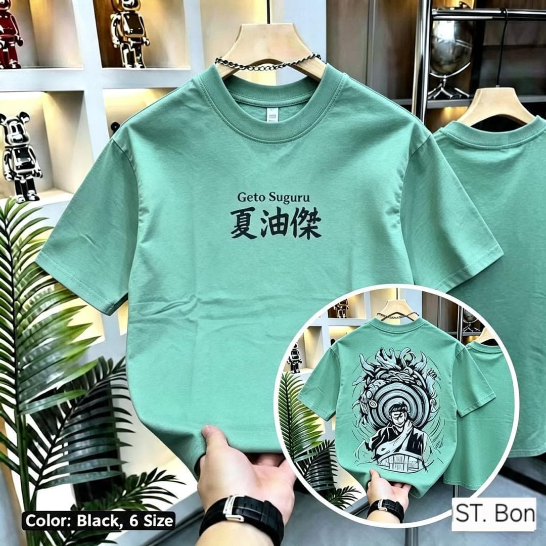 Green Geto Suguru crop top held to show front and circular back graphic view.