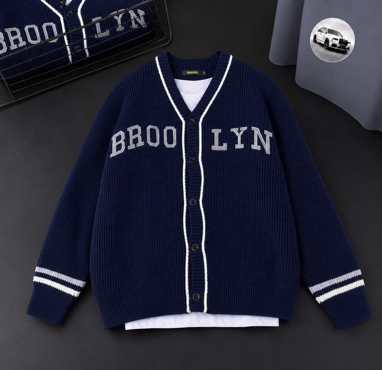 Navy Brooklyn cardigan with white trim layered over a white tee.