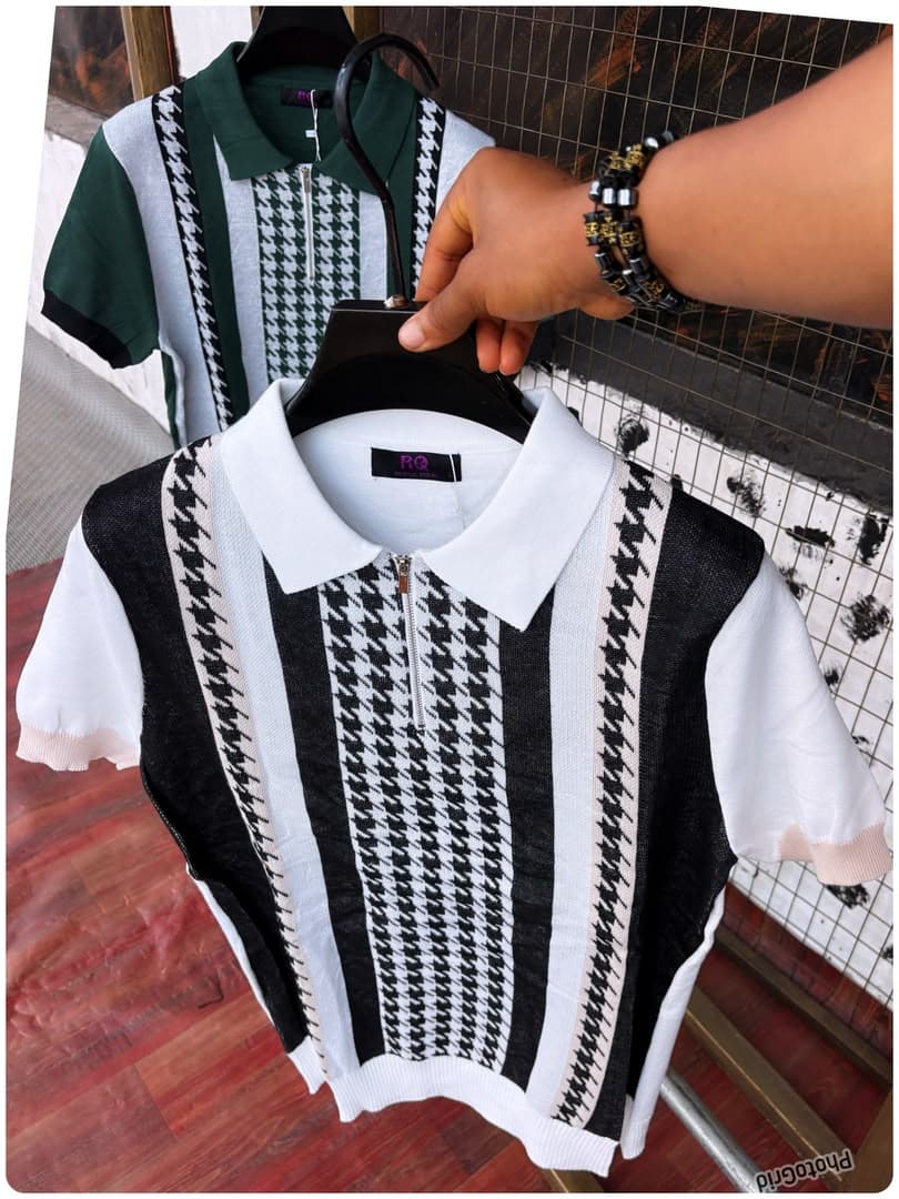 Black and white houndstooth knit polo in foreground with green and white version behind.