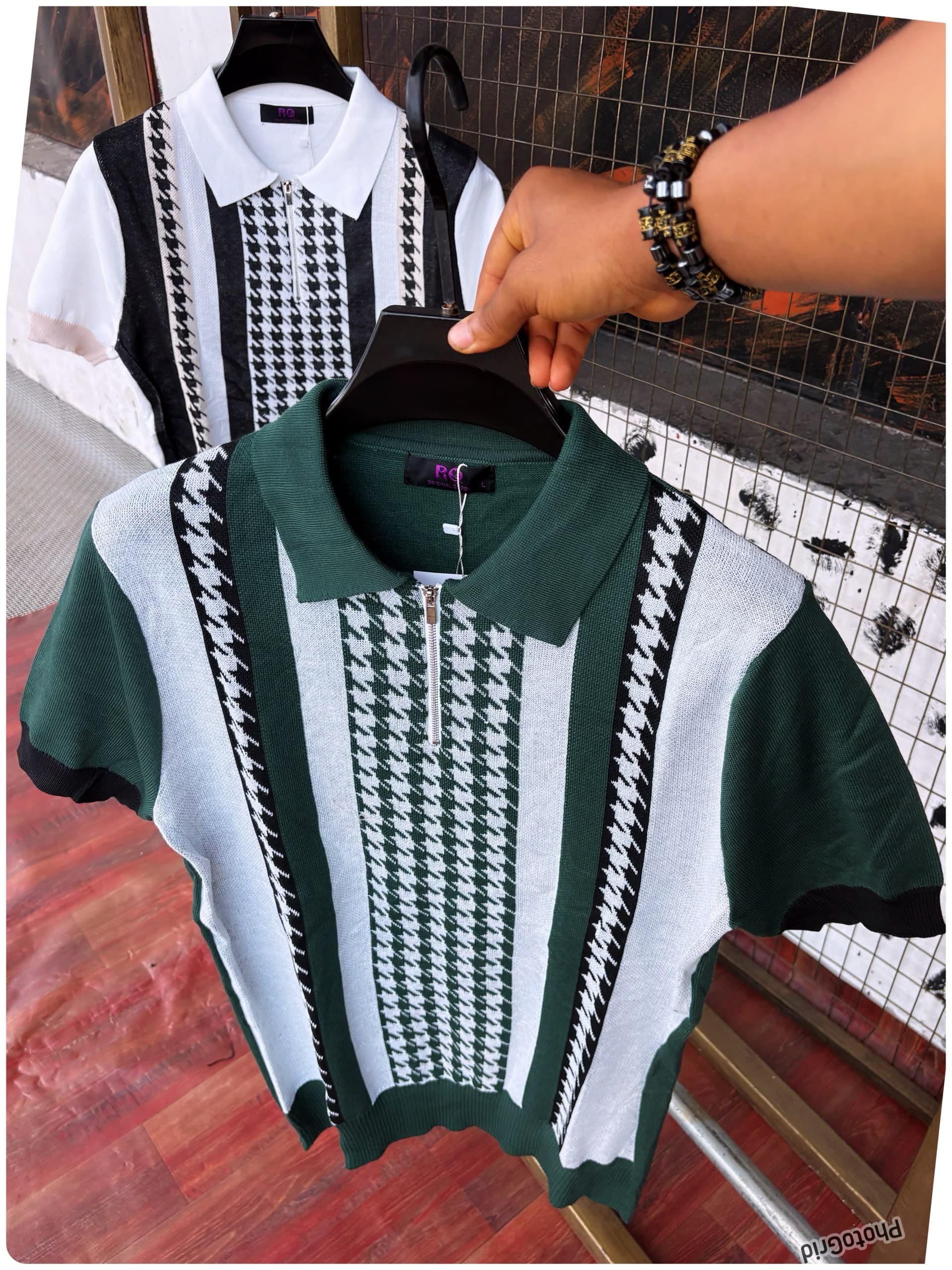 Green and white houndstooth knit polo in foreground with black and white version behind.