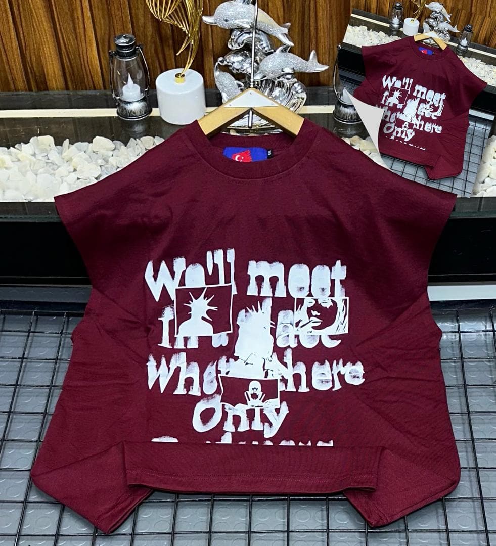 Burgundy oversized sleeveless sweatshirt with white graphic print laid flat.