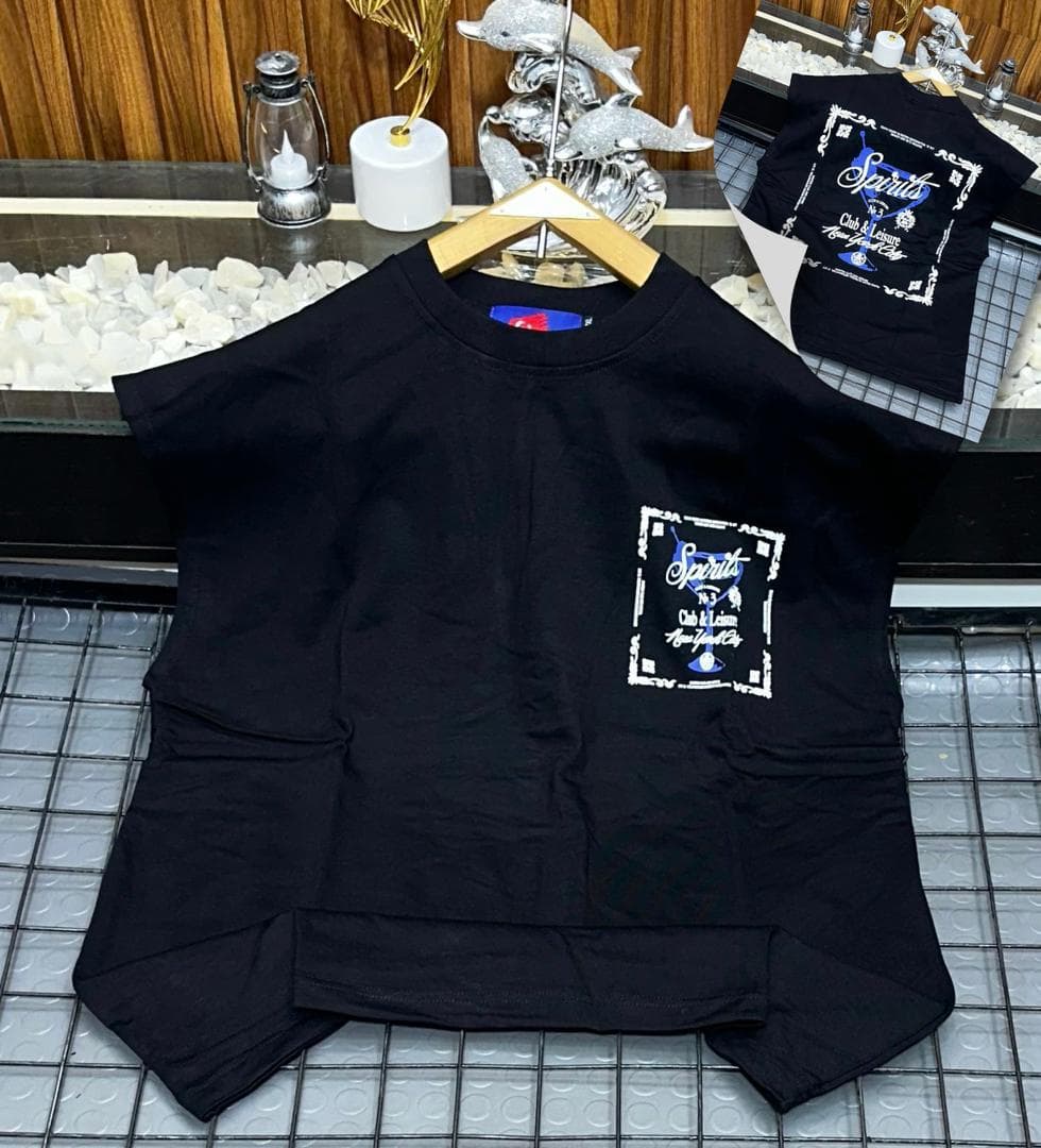 Black Spirits graphic sleeveless sweatshirt on hanger with back inset.