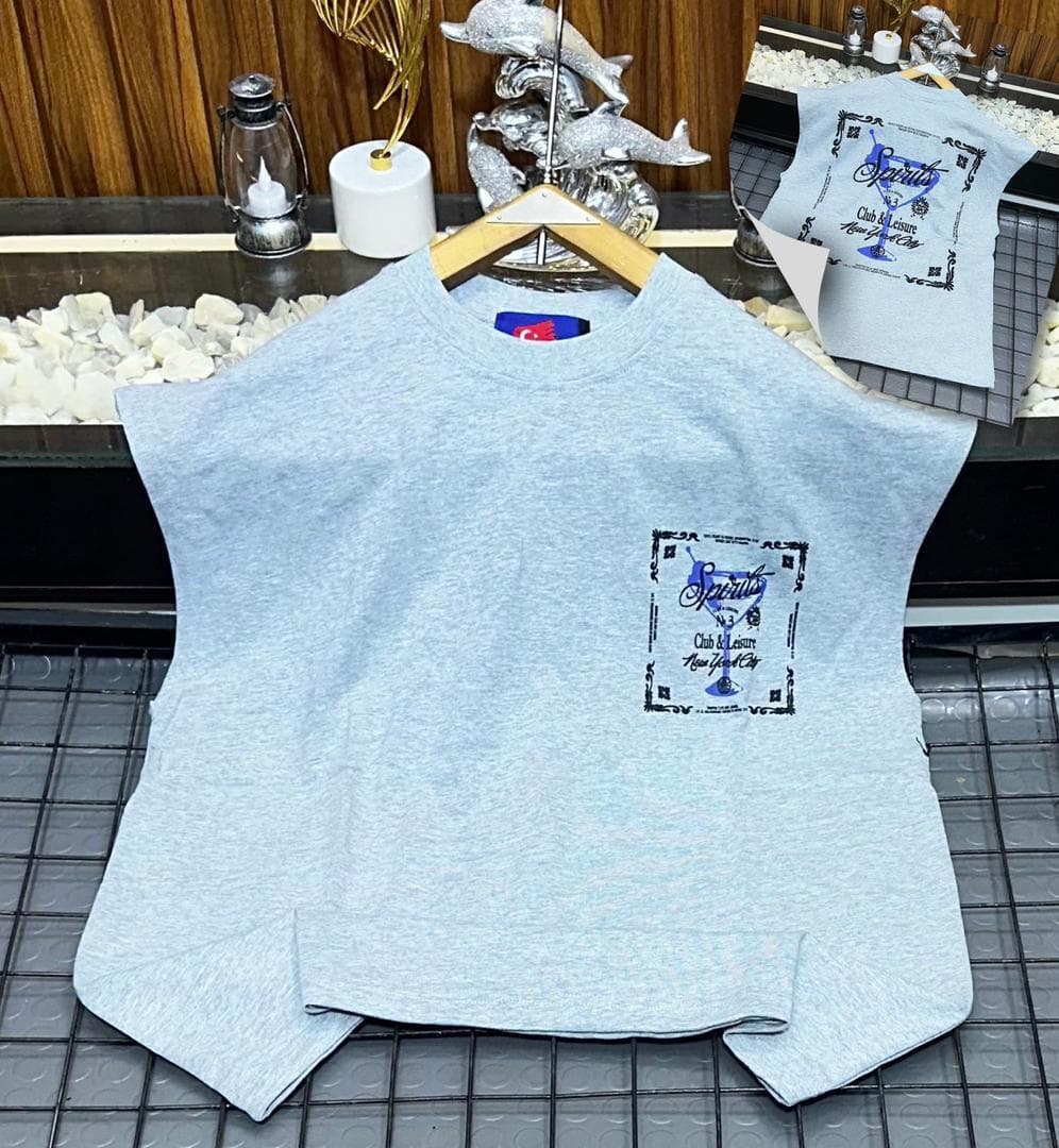 Light blue Spirits graphic sleeveless sweatshirt on hanger with back inset.